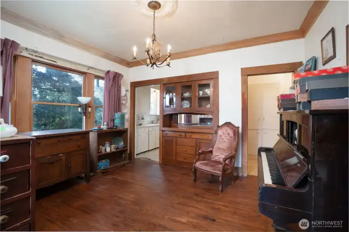 The gorgeous built-in lets you store all your dining and entertaining goodies.  Doorway to left leads to kitchen, doorway to the right leads to more built-ins, 2 bedrooms, and a full bath.