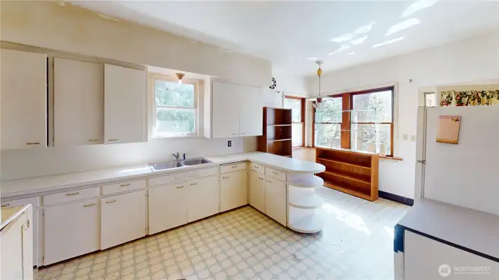 The kitchen is HUGE- could be redone into a chef's dream kitchen.