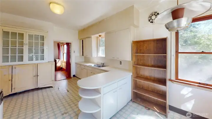 There is so much space in this kitchen- room for informal dining or a craft space or a total new configuration.
