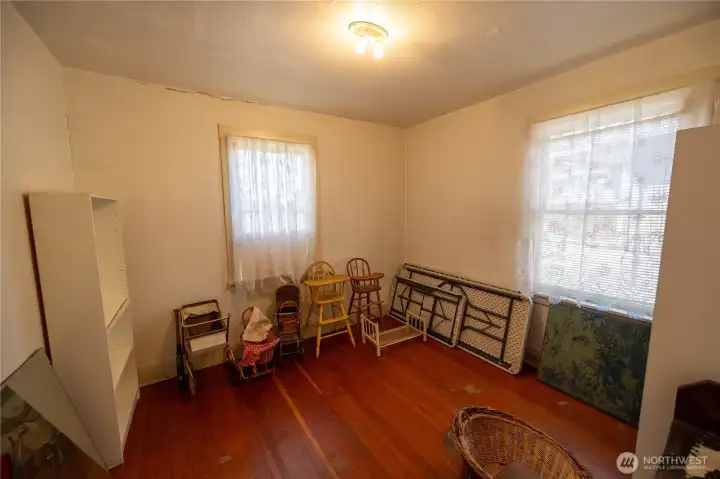 The second main floor bedroom has fir floors.