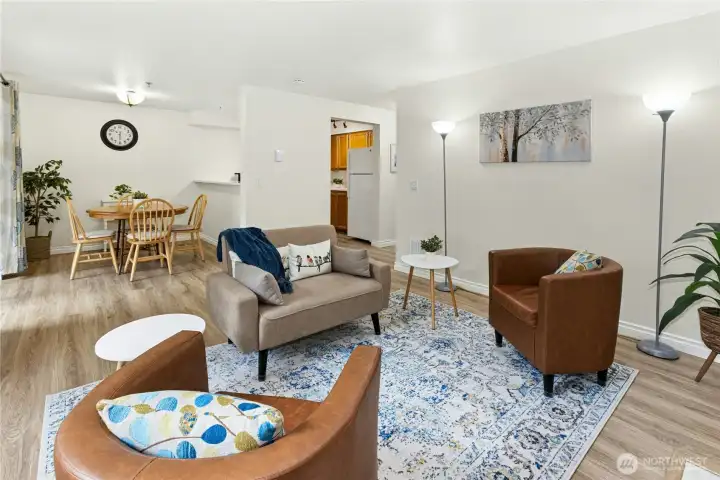 The Living Room is open to the dining room and kitchen.