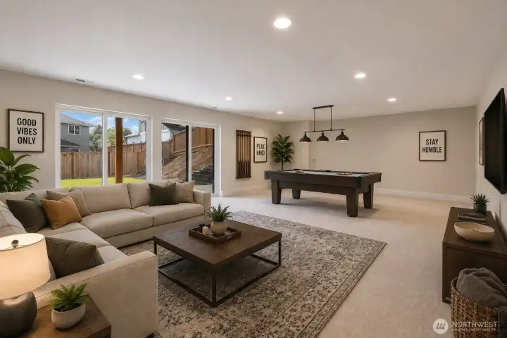 Downstairs set up for separate living space with bedroom, bedroom, kitchette and laundry hookup
