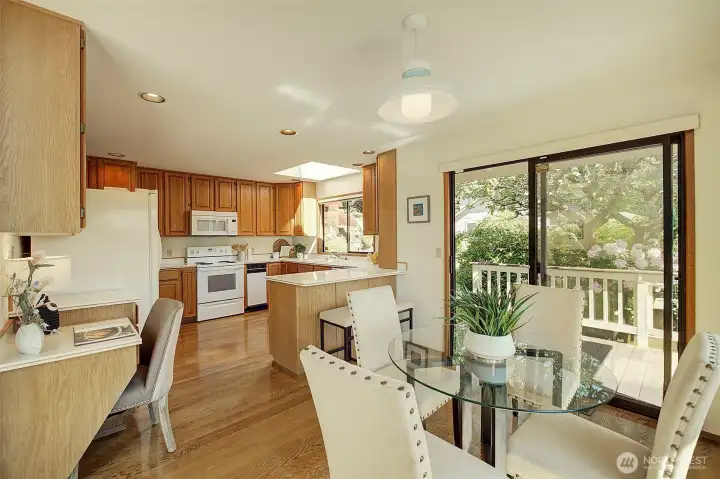 Kitchen dining are with built-in desk.