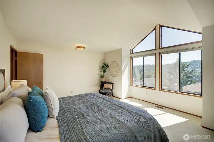 Primary bedroom with more gorgeous views.