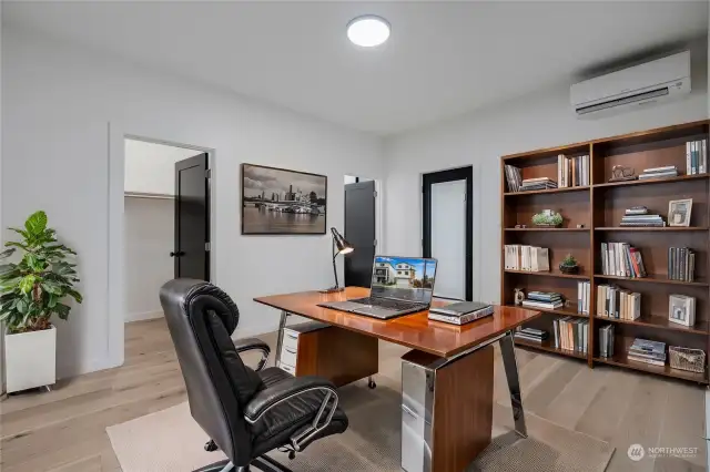 Another look at this main floor 2nd primary suite staged as an in-home office.  [Photo is virtually staged.]