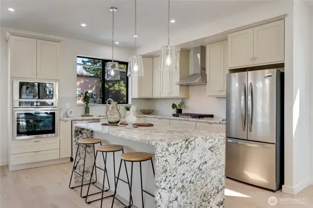 Gorgeous custom cabinetry, full-height  backsplash and 3cm countertops