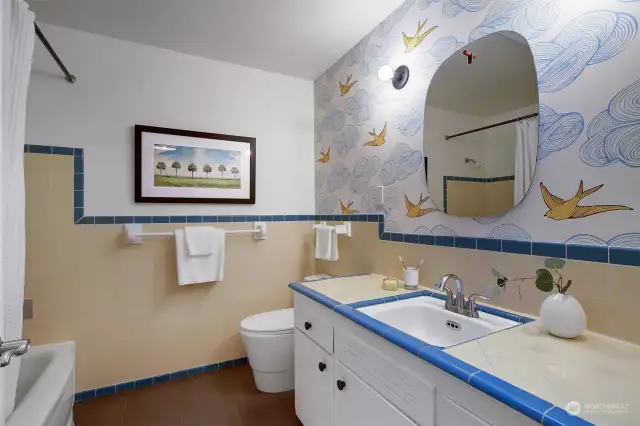 Hallway main floor bath with delightful, original tile.