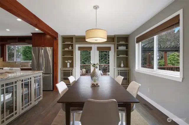 Custom built-ins surround the dining and kitchen.