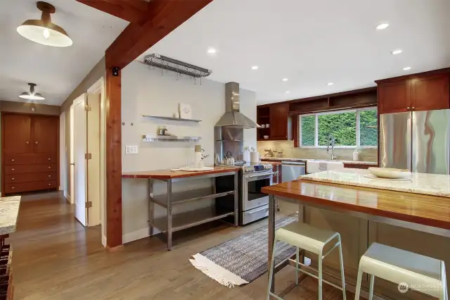 Sleek, modern kitchen with many work stations.