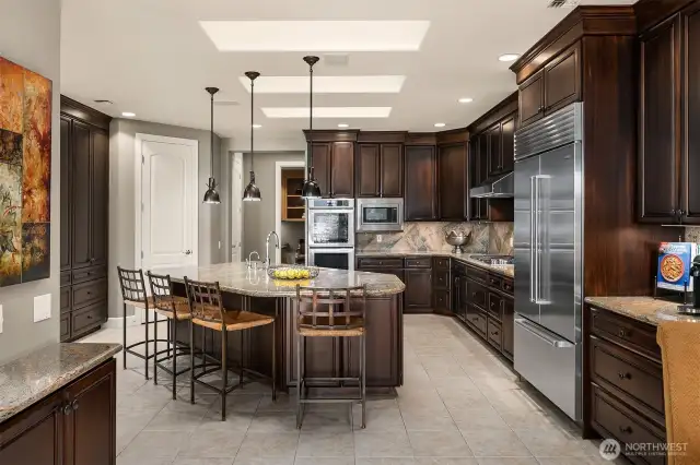 a trio of skylights bathe the gourmet kitchen in rich natural light!