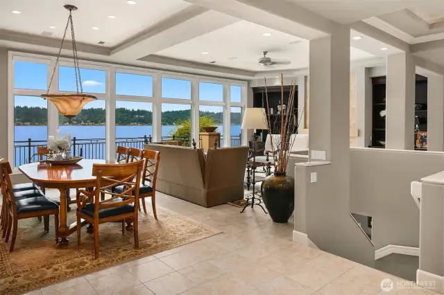 his open concept floor plan lives large with graceful transitions between living and entertainment venues.