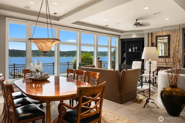An antique chandelier delivers drama and illumination to the open concept dining area.