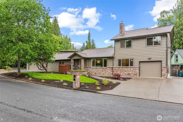Spectacular corner lot near town w/shop, pond, garden space & more!