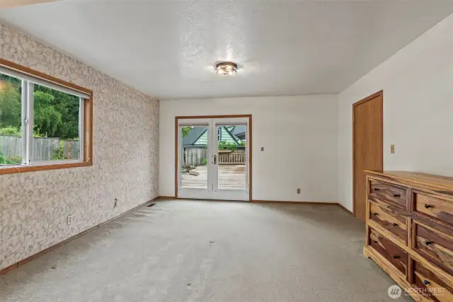French doors lead to deck/patio/pond & gardens from your giant first level main suite.