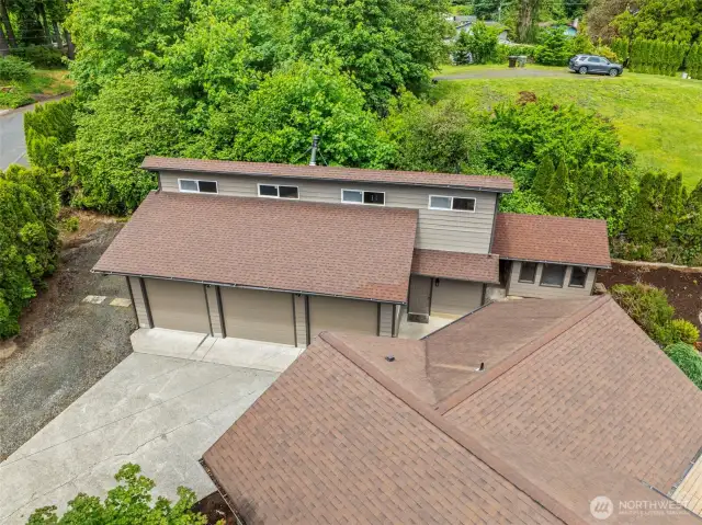 Three bay shop w/way more than meets the eye! Studio/office/loft (658 sq ft) plus shop space appx 1300 sq ft per appraisal & county record. Plus there is an attached garage on the home.  No shortage of storage & parking! Level RV parking next to shop.