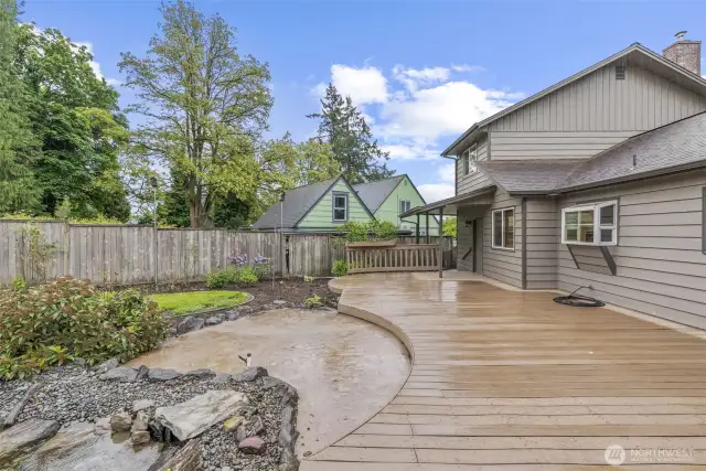 Beautiful deck, concrete patio and gorgeous pond w/water feature!