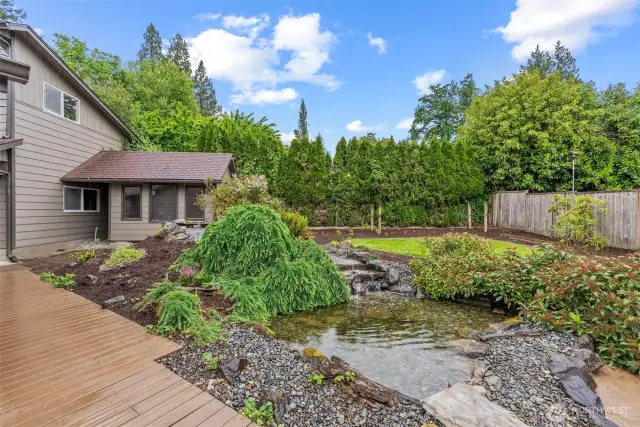 Gorgeous pond with waterfall, lush yard, garden shed/chicken coop or you decide!