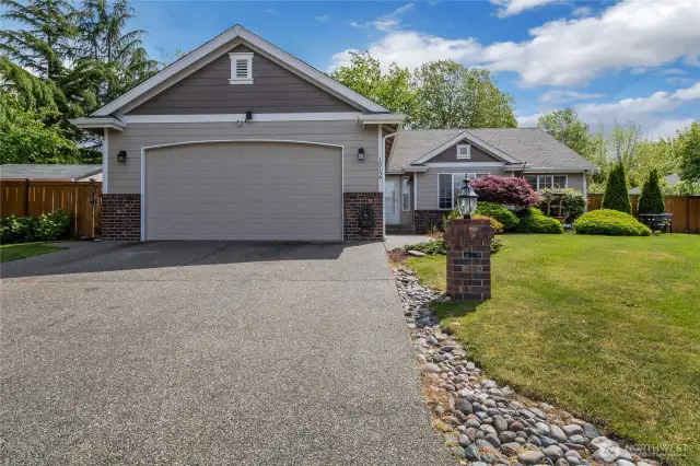 Gorgeous one level home at High Cedars Golf Course! elongated driveway, mature landscaping, luscious greenery and flowery flower beds, wow!