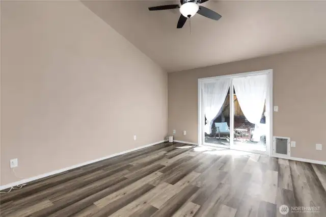 Yet another area to furnish and use! Sliding glass door leads to a large patio, mature landscaping and a way to escape!