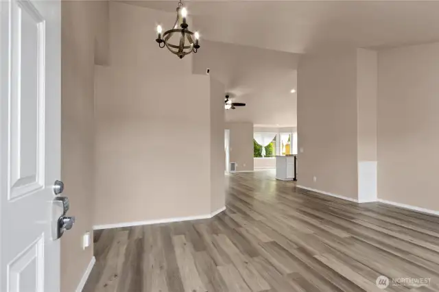 As you come in through the front door, gleaming new flooring, paint and fixtures about.
