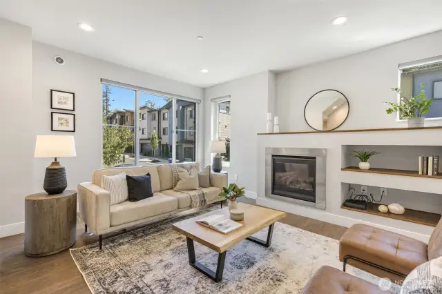 High ceilings bring airy charm to the room, paired with thoughtful built-ins and motorized Hunter Douglas blinds offering effortless light control and a clean, modern aesthetic