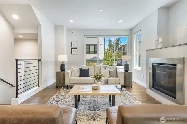 Kick back by the cozy gas fireplace in a living room made for easy entertaining