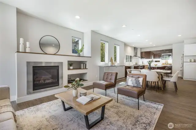 A spacious open floor plan sets the stage for entertaining, with seamless flow between kitchen, dining, and living areas designed to bring everyone together
