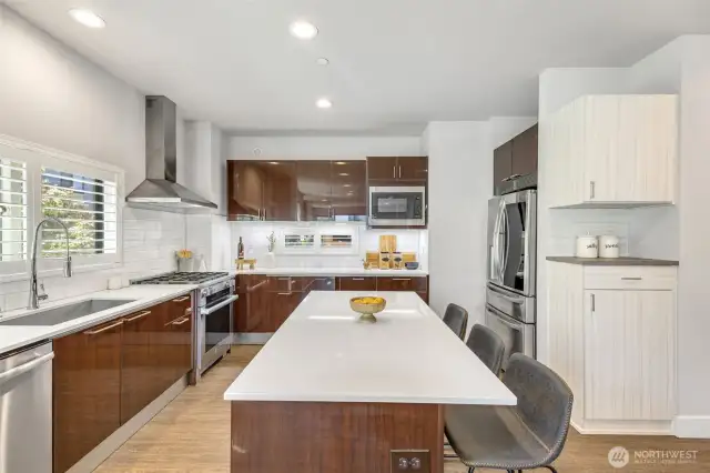 Large kitchen island is perfect for chopping, chatting, or sipping morning coffee