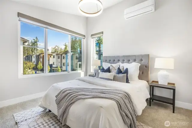 Primary bedroom equipped with mini-split AC for enhanced temperature control and restful sleep