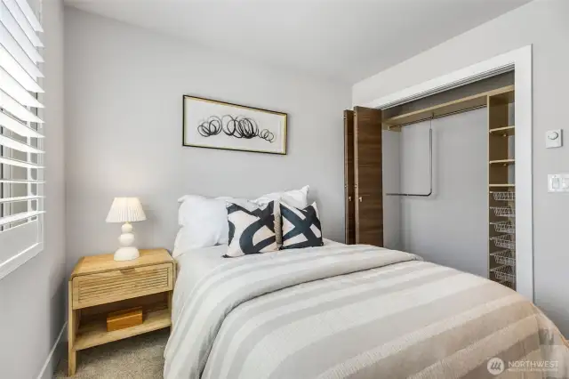 Bedroom one has closet with sliding doors & California Closet organizers