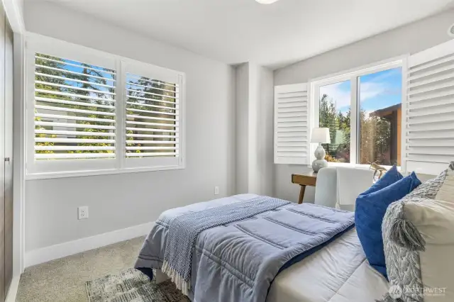 Bedroom two also has magnetic door stops and sleek Norman brand window shutters