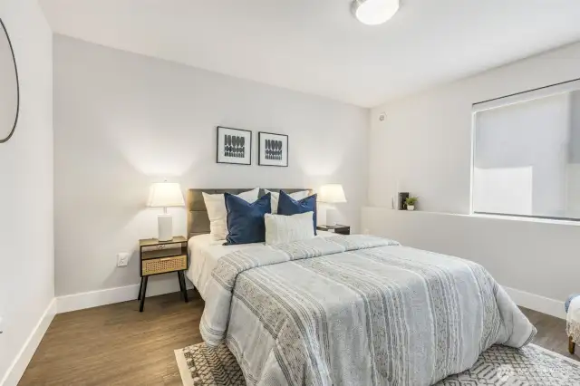 Lower level includes a generously sized fourth bedroom, ideal for guests, remote work, or additional living space