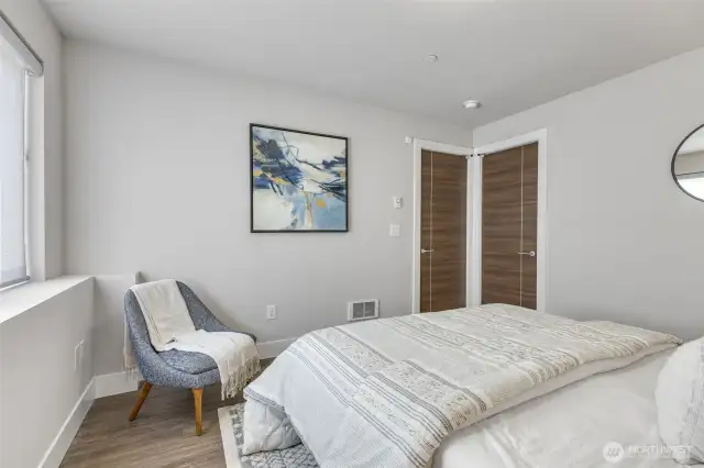 A spacious walk-in closet offers abundant storage and smart organization