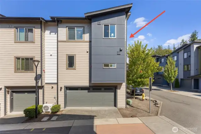 Spacious two car garage includes Tesla EV charger and a full suite of California Closets upgrades — including a custom workbench, premium storage cabinetry, and an integrated wall track system designed for seamless organization