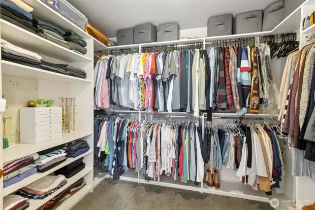 Primary walk in closet with built in custom closets1