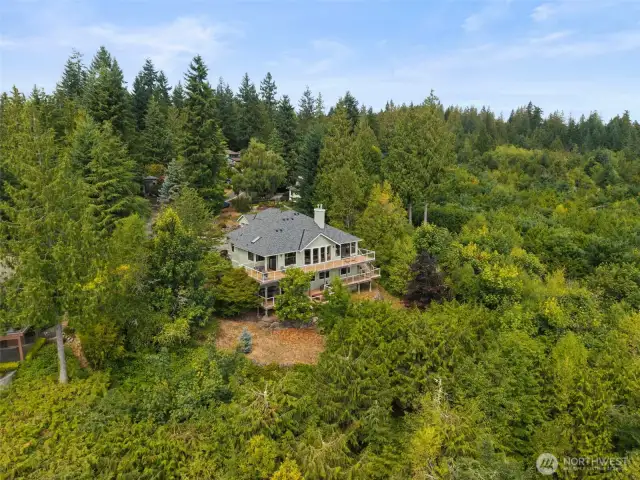 Sited on 3/4 acre, the home is surrounded by nature at it's finest; watch eagles soar and deer wander through.