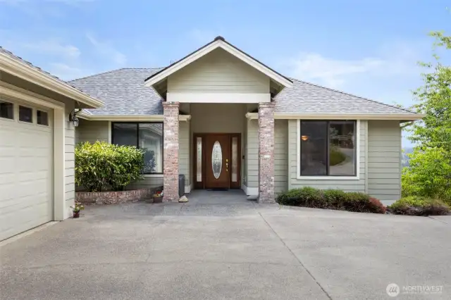 This elegant covered entry welcomes you home. A three year-old roof and four year-old heat pump provide peace of mind.