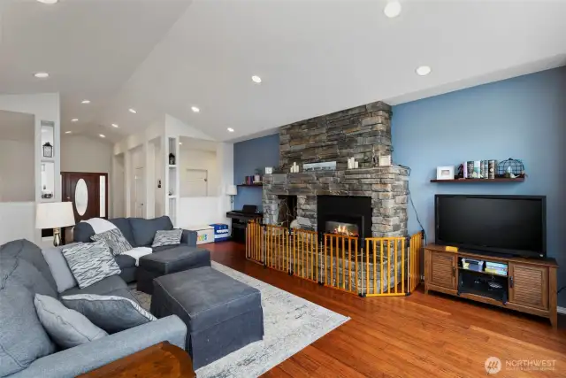 Another view of the living area with vaulted ceilings feels light and airy.