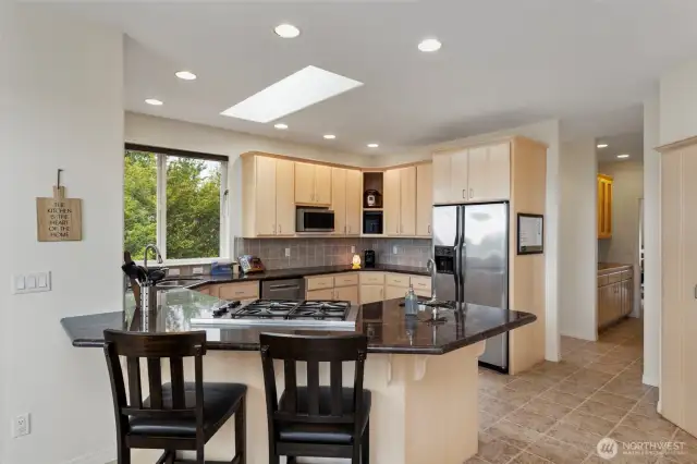 Cozy eating bar or work space is central to the heart of this home.