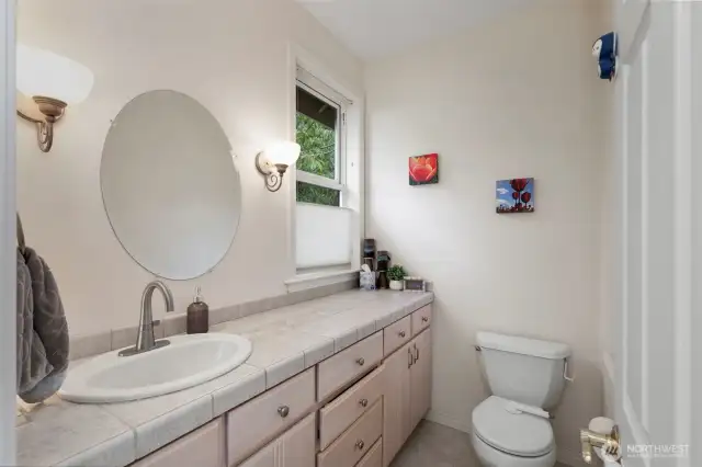 A handy powder room is tucked into the hallway behind the kitchen.