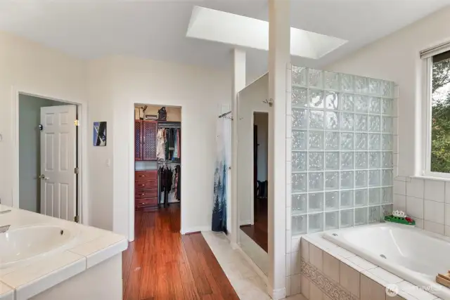 The spa-like primary ensuite pampers you with large soaker tub, huge tiled shower and double vanity.