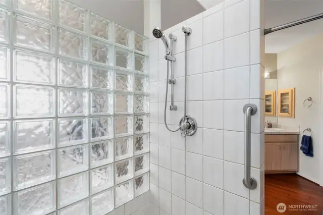 Pamper yourself in the large shower with tile and glass-block surround.