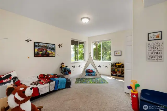 Spacious fourth bedroom has space for all your treasures, and opens into a full bath.