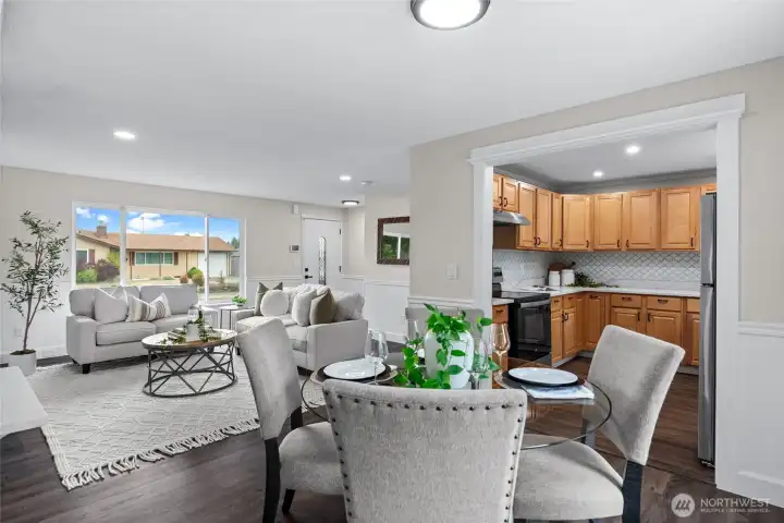 A thoughtfully designed floor plan unites the main living areas, fostering a welcoming environment ideal for both gatherings and quiet moments.