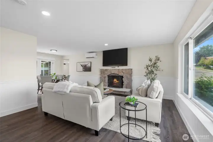 Beautiful laminate planked flooring throughout the home blend each room together seamlessly while also opening up the space to feel large and airy.