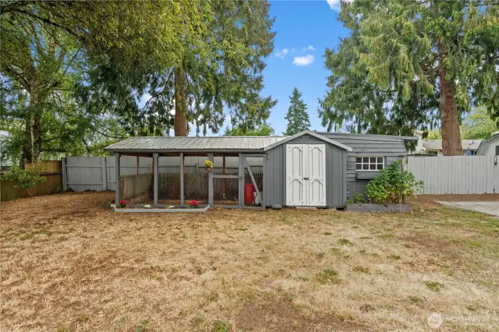 Picture-perfect and multifunctional, this enclosed chicken coop can also be used as a secure pet enclosure or a sheltered workspace.