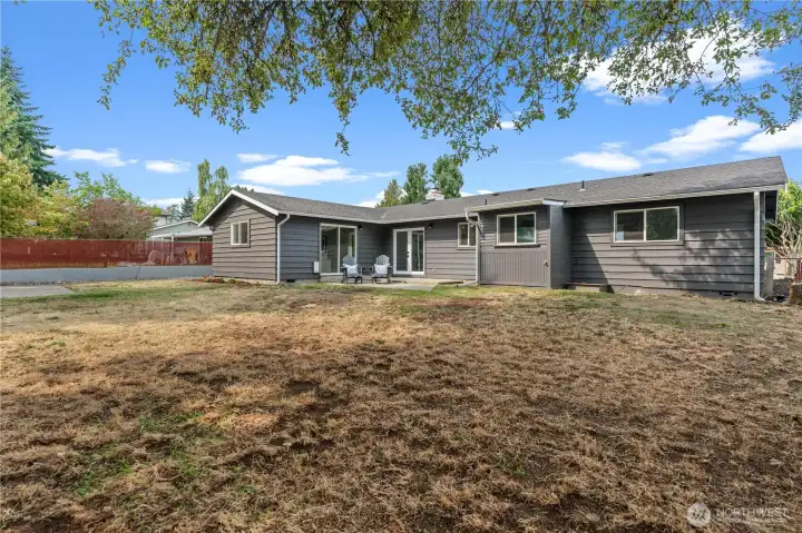 Whether you extend the patio area for an elaborate outdoor living area, or fill the yard with toys, this backyard is full of potential.