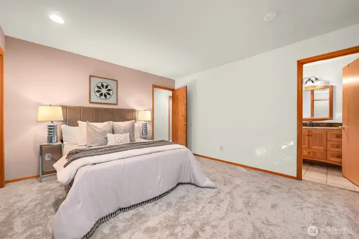 Spacious primary bedroom with ensuite bath