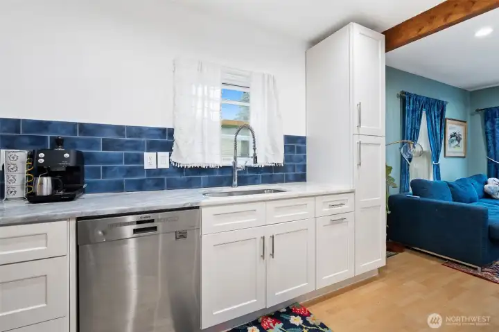 All new cabinetry, natural stone countertops, and designer tile backsplash.