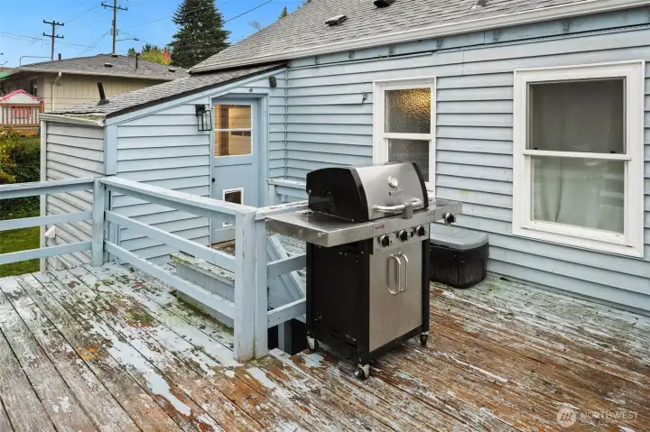 Expansive deck overlooks a fenced yard backing to Hilltop Park.